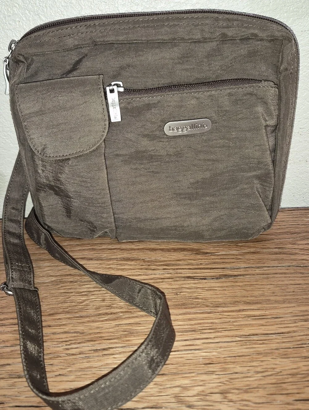 Brown Nylon Baggallini Crossbody bag featuring multiple exterior zipper pockets